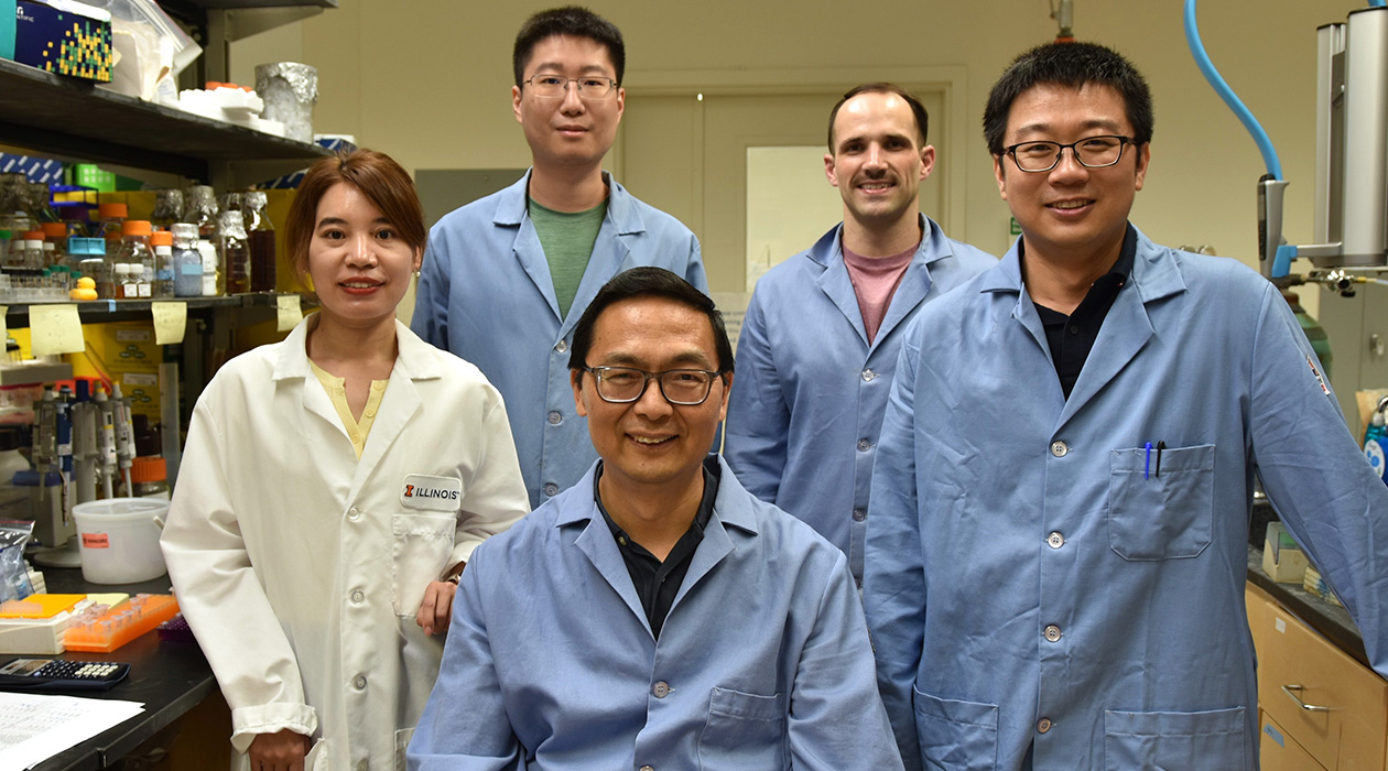 from left, Postdoc Yujie Yuan, Postdoc Zhengyi Zhang, CABBI Conversion Theme Leader Huimin Zhao (seated), Ph.D. Candidate Wesley Harrison, and  Postdoc Maolin Li.