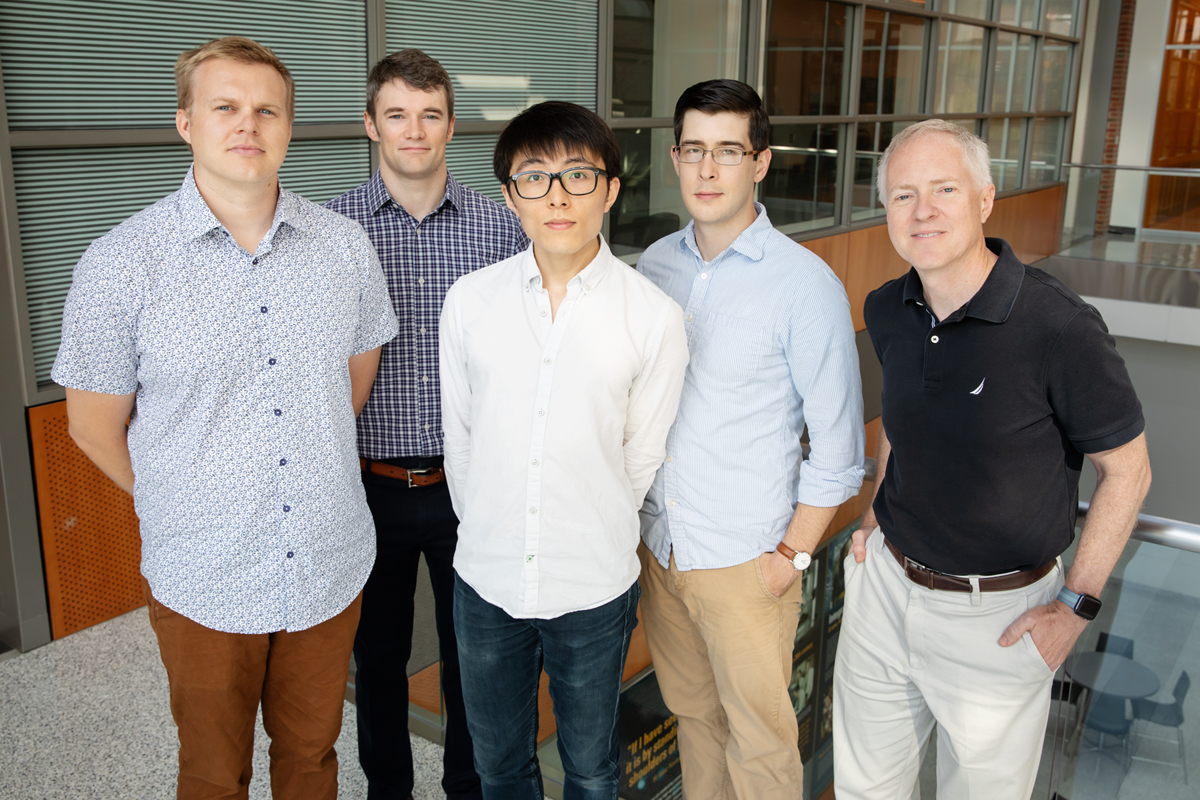 Illinois researchers developed a method to detect cancer markers called microRNA with single-molecule resolution, a technique that could be used for liquid biopsies. From left: postdoctoral researcher Taylor Canady, professor Andrew Smith, graduate student Nantao Li, postdoctoral researcher Lucas Smith and professor Brian Cunningham.