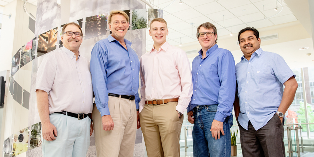 Researchers – including, from left, Illinois geology professors Robert Sanford and Bruce Fouke; Bucknell University undergraduate student Kyle Fouke; Glenn Fried, the director of the Carl R. Woese Institute for Genomic Biology core facilities; and Mayandi Sivaguru, the associate director of IGB core facilities – analyzed a bacterium with characteristics that make it a good candidate for life on other planets.