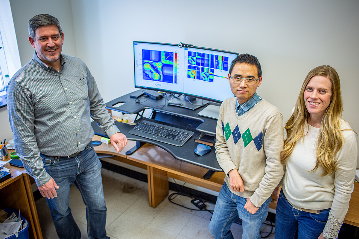 USDA-ARS Research Plant Physiologist Carl Bernacchi (left) with Postdoctoral Researchers Peng Fu (middle) and Katherine Meacham-Hensold (right) are working to revolutionize how scientists screen plants for key traits at the field level and making this technology more accessible to other scientists to increase crop yields