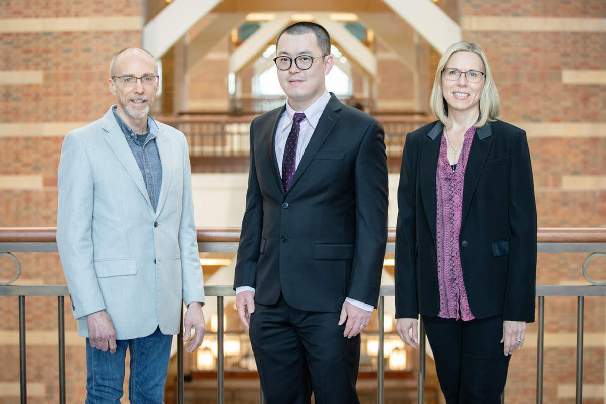 Beckman Institute director Jeffrey Moore, left, postdoctoral researcher Hai Qian and materials science and engineering head Nancy Sottos led a team of Illinois engineers in the development of a new rapid-acting, reversible polymer that changes color when it is about to fail.     