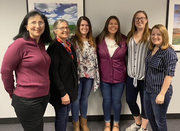 Research from the University of Illinois shows male piglets whose mothers were ill during pregnancy show genetic changes in the amygdala and are less resilient to a second stressful event, weaning, than females and piglets whose mothers weren't ill during pregnancy. From left: Sandra Rodriguez-Zas, Laurie Rund, Courtni Bolt, Olivia Perez, Haley Rymut, and Marissa Keever-Keigher